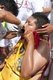 Thailand: Devotees or 'ma song' returning from the parade have their chosen implements removed from their faces, San Chao Chui Tui (Chinese Taoist temple), Phuket Vegetarian Festival